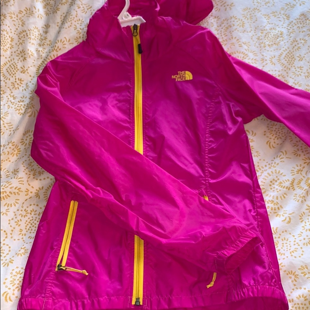 Pink and yellow North Face wind breaker
